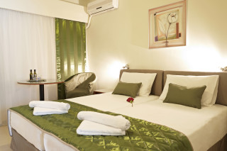 Standard Room Galaxias Luxury Bedroom with great decoration, table and air conditioning