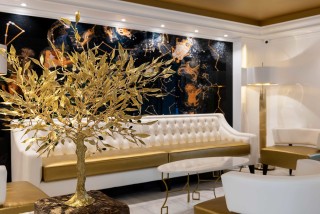 gallery galaxias hotel cozy lobby with elegant sofas, painting and interior trees